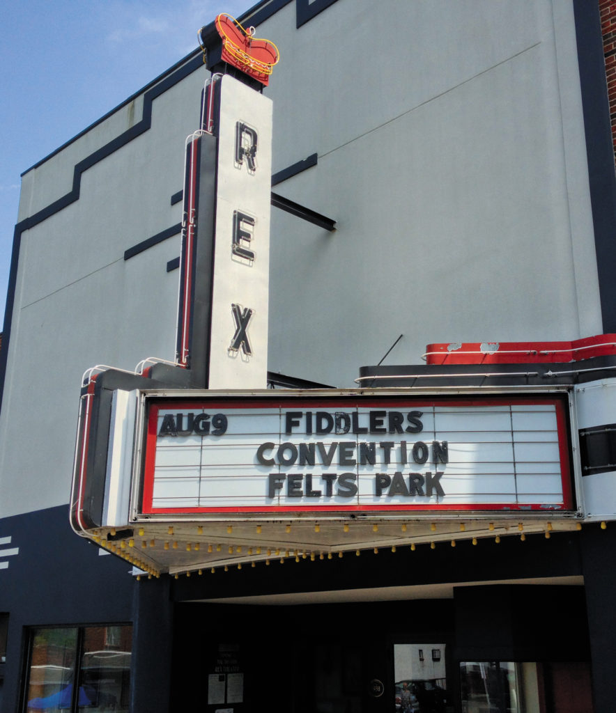 The marquee at the Rex Theater advertises a fiddlers convention.