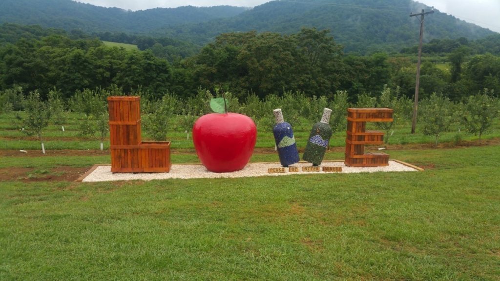 Peaks of Otter Winery's LOVE sign is made of crates, a large apple and two wine bottles which form the V.