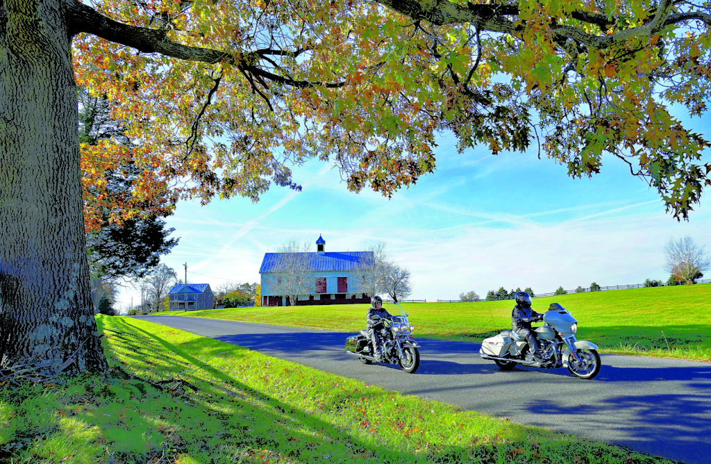 Bicyclists ride on a paved Virginia trail.