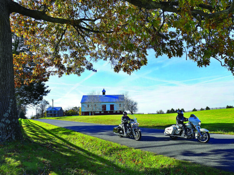 Bicyclists ride on a paved Virginia trail.