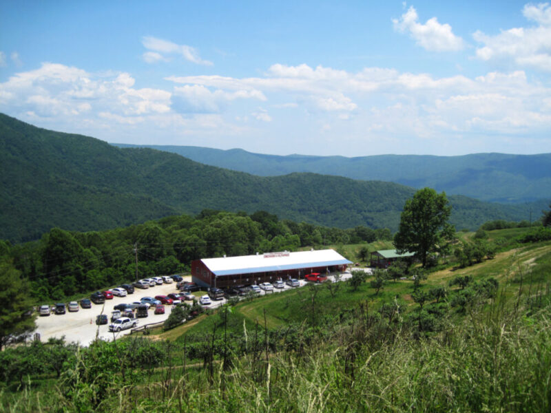 View of the orchard building and the mountains in the distance.