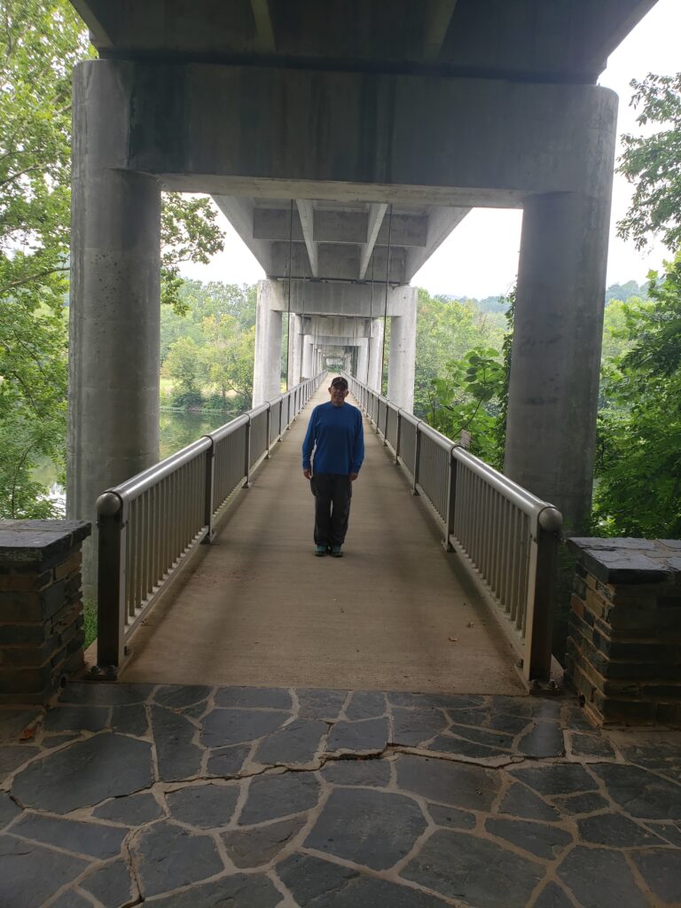 The concrete pedestrian walkway at James River travels beneath the Parkway for views of the James River.
