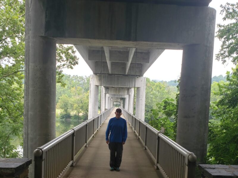 The concrete pedestrian walkway at James River travels beneath the Parkway for views of the James River.