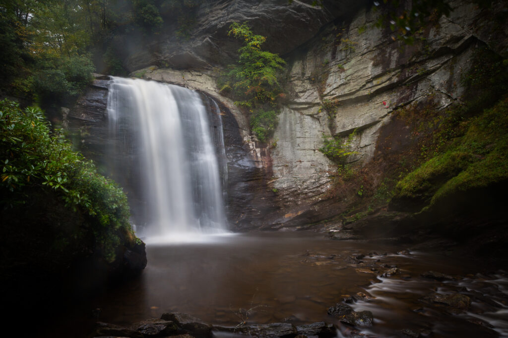 Looking Glass Falls drops over a rock ledge straight into the pool at the bottom of the falls.