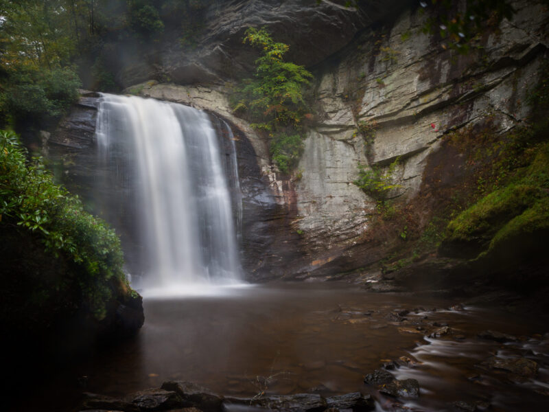 Looking Glass Falls drops over a rock ledge straight into the pool at the bottom of the falls.