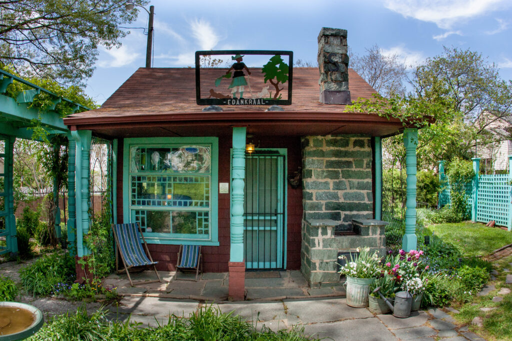 Turquoise paint highlights the posts and windows of the tiny writing hideaway at the Anne Spencer House Museum and Garden.