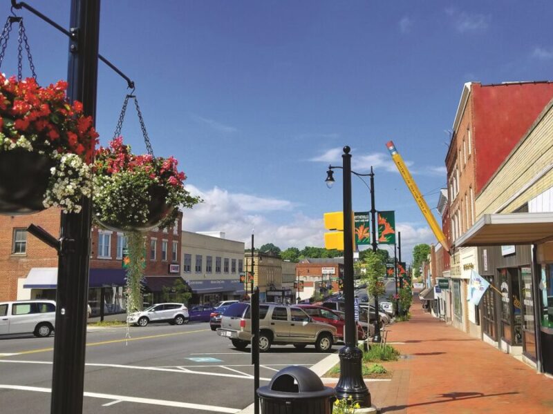 Cars lining the sidewalk in sunny downtown Wytheville, VA
