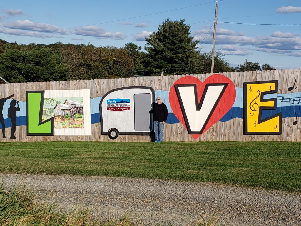 The only LOVEwork on the Parkway is at Fancy Gap Cabins & Campground and includes their logo and a painting of nearby Mabry Mill.