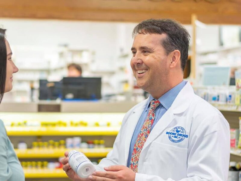 Corey Furman assist a customer at a Boone Drugs pharmacy.