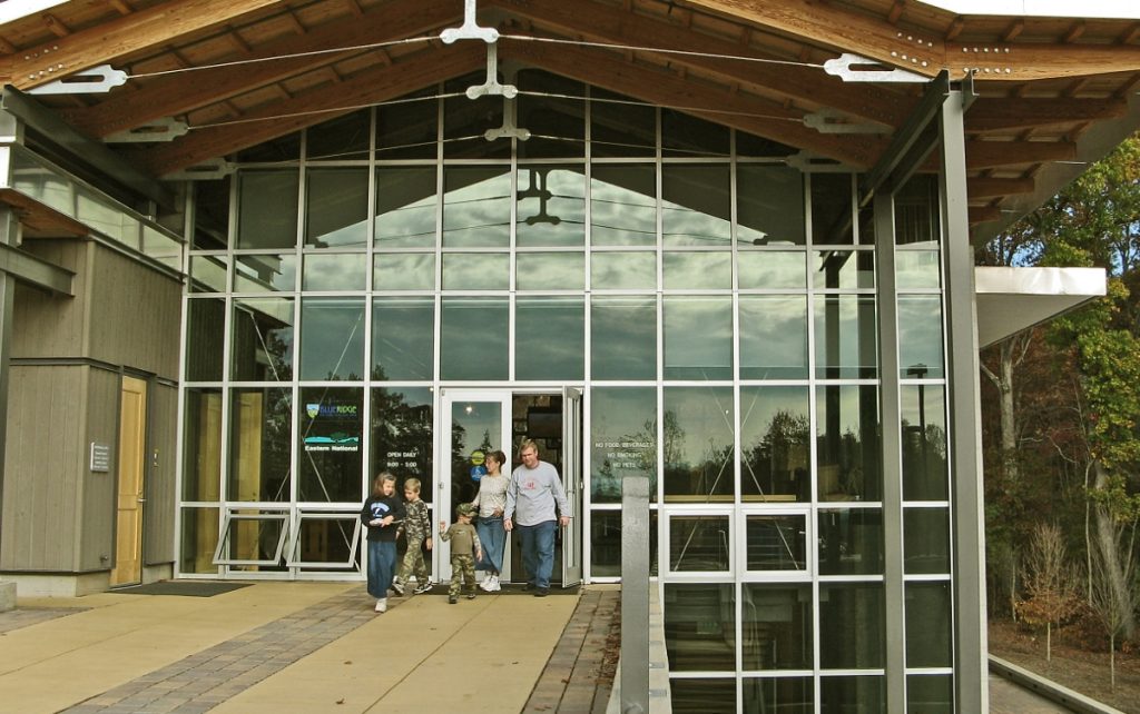 a family exits one of the Blue Ridge Parkway Visitor Centers