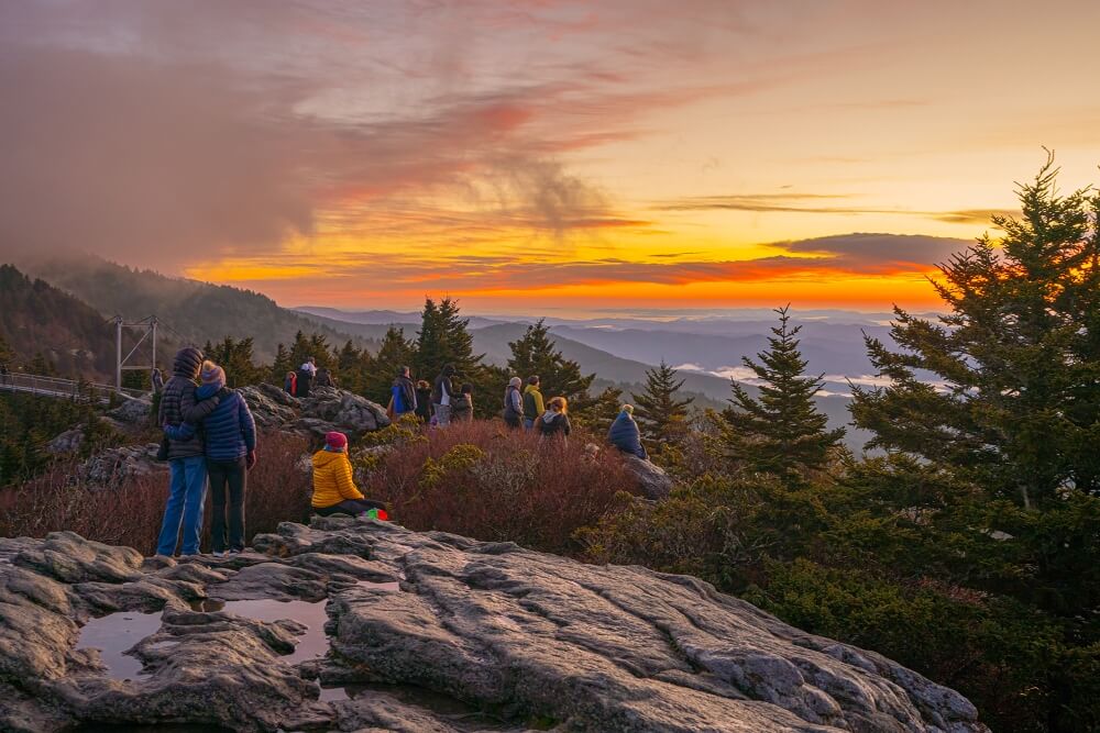 a family admires the sunset along the blue ridge parkway